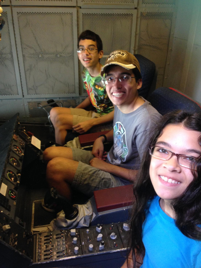 John, me, and Gloria on the plane.